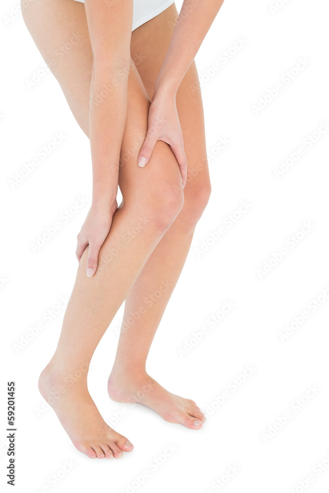 Close-up low section of a fit woman with leg pain Close-up low section of a fit woman with leg pain