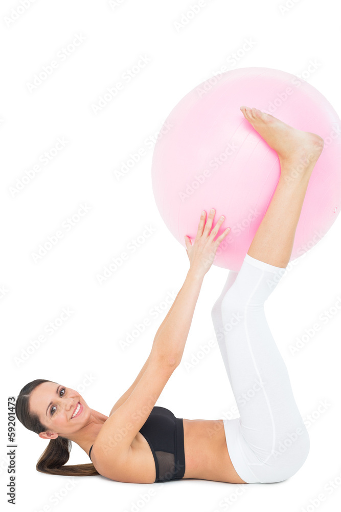 Portrait of a fit woman exercising with fitness ball Portrait of a fit woman exercising with fitness ball