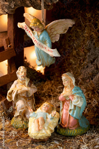 Nativity scene in a stable, with old hand-painted figures photo