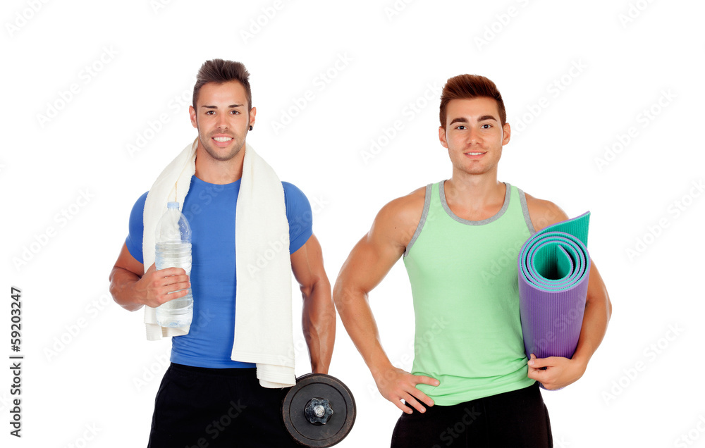 Two muscular men with gym equipment Two muscular men with gym equipment