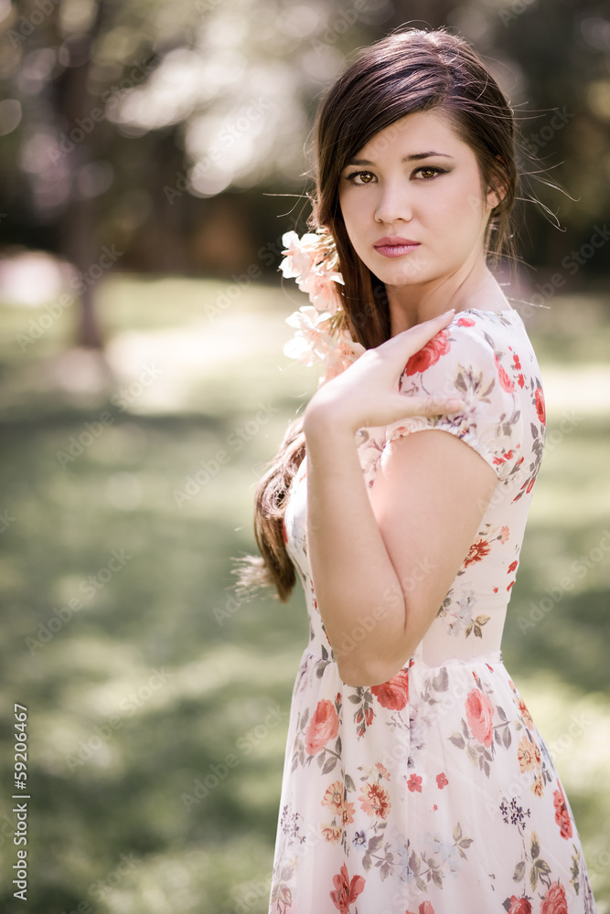 Young beautiful japanese woman with pink and red flowers Young beautiful japanese woman with pink and red flowers