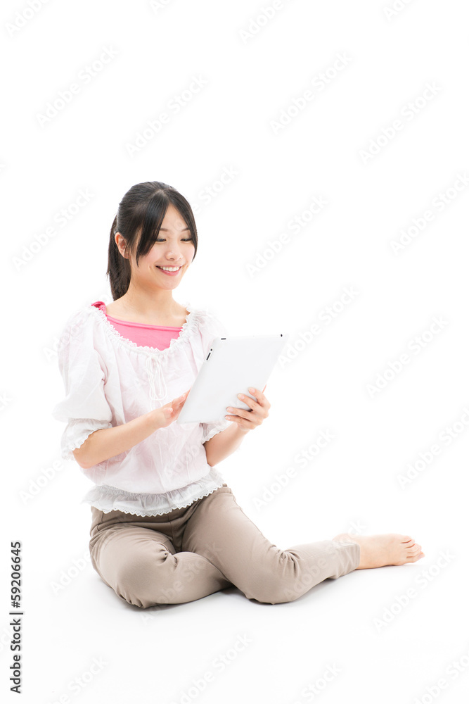 young asian woman using tablet computer on white background young asian woman using tablet computer on white background