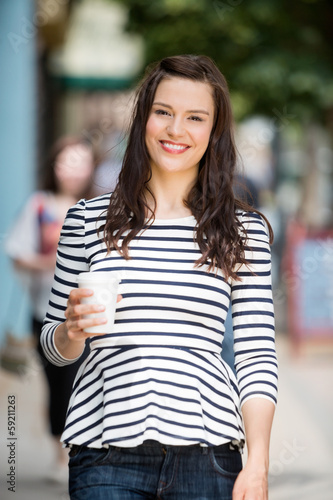 Woman Holding Disposable Coffee Cup