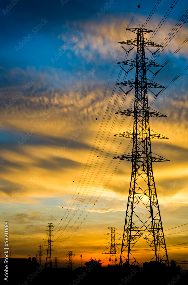 High voltage poles on sunset
