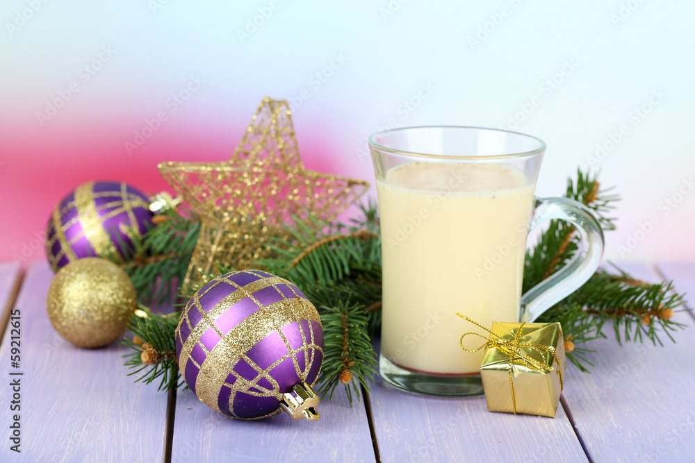 Cup of eggnog with fir branches and Christmas decorations Cup of eggnog with fir branches and Christmas decorations