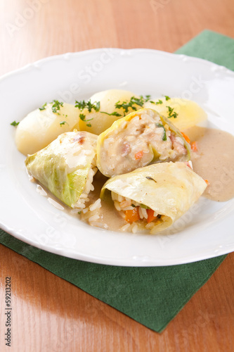 Cabbage rolls stuffed with rice and sauce