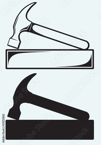 Hammer and bricks isolated on blue background