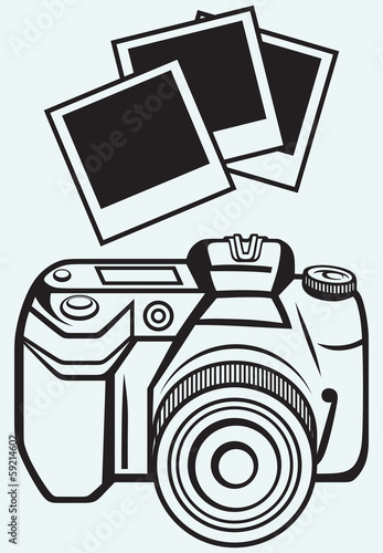 Digital photo camera isolated on blue background