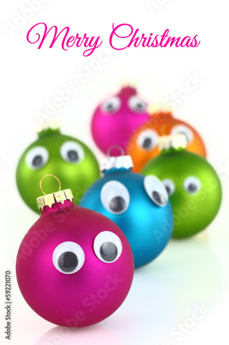 Colorful cute Christmas balls with eyes isolated on white