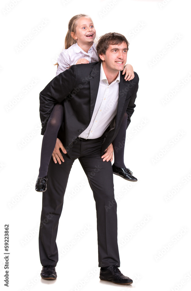 Little girl enjoying piggyback ride with her father Little girl enjoying piggyback ride with her father