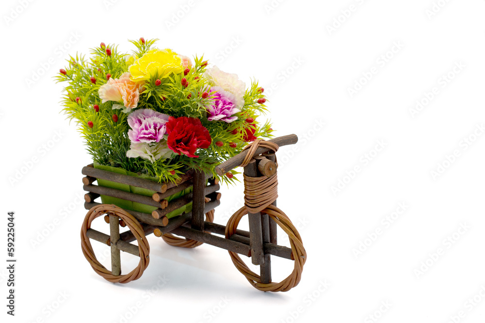 Wooden bicycle with colorful carnations with clipping path