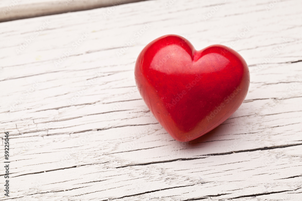 Valentines Day. Red heart on a wooden table. Valentines Day. Red heart on a wooden table.