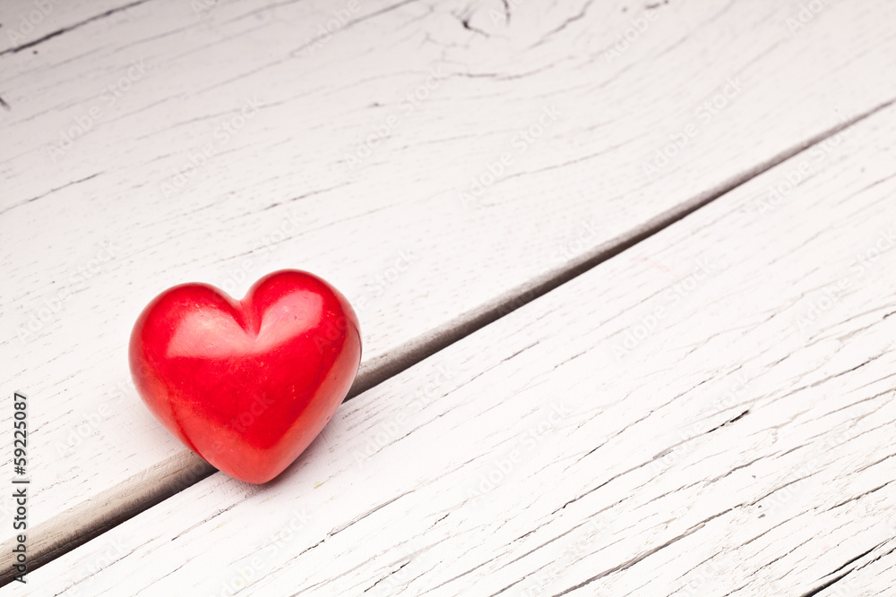 Valentines Day. Red heart on a wooden table. Valentines Day. Red heart on a wooden table.