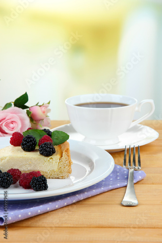 Slice of cheesecake with raspberry and blackberry
