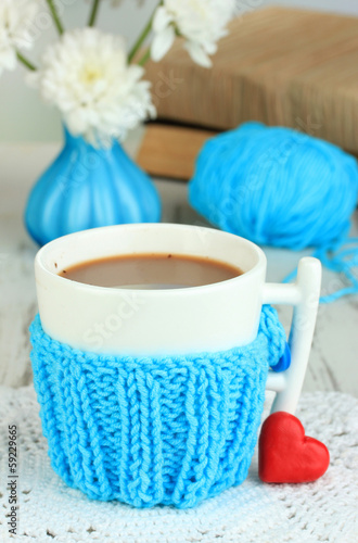 Cup with knitted thing on it close up