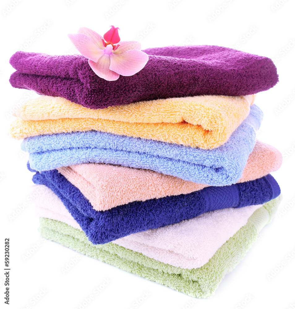 Orchid flower and towels, isolated on white Orchid flower and towels, isolated on white