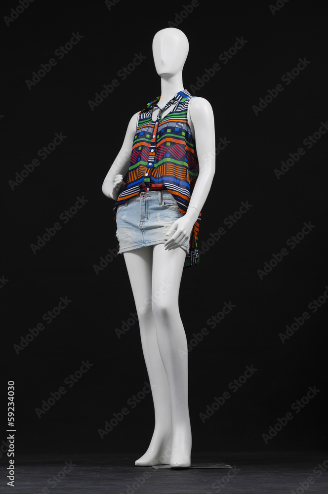 mannequin in elegant shirt and jeans shorts-black background