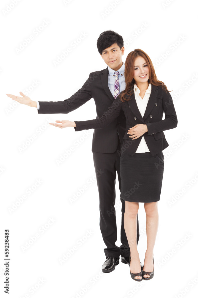 Young smiling business woman and man with welcome gesture Young smiling business woman and man with welcome gesture