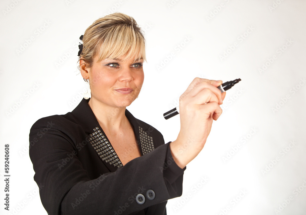 Studio portrait of a cute blond girl writing on a transparent wa Studio portrait of a cute blond girl writing on a transparent wa