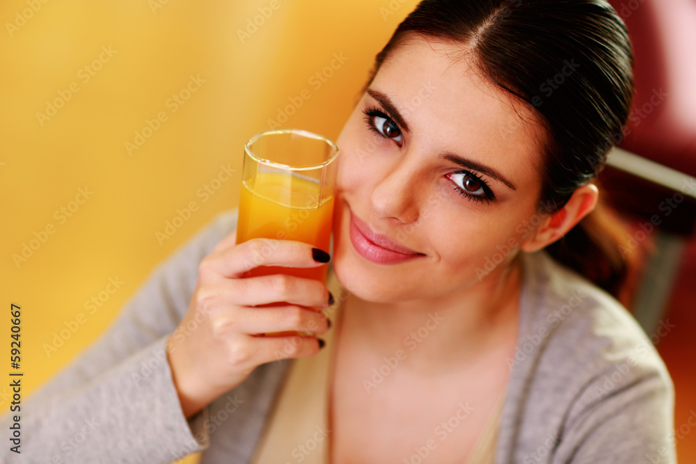 happy woman holding glass of orange juice happy woman holding glass of orange juice