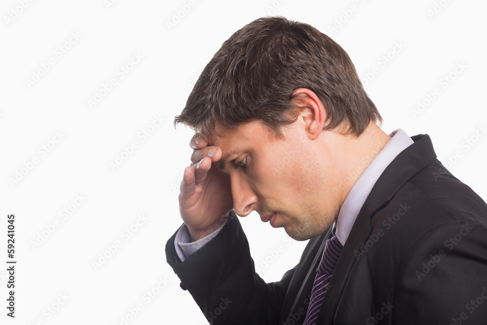 Close-up side view of a worried businessman Close-up side view of a worried businessman