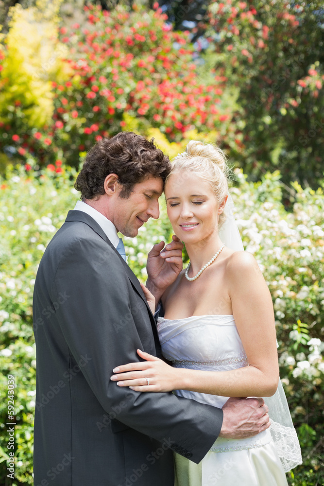 Romantic smiling newlyweds embracing Romantic smiling newlyweds embracing