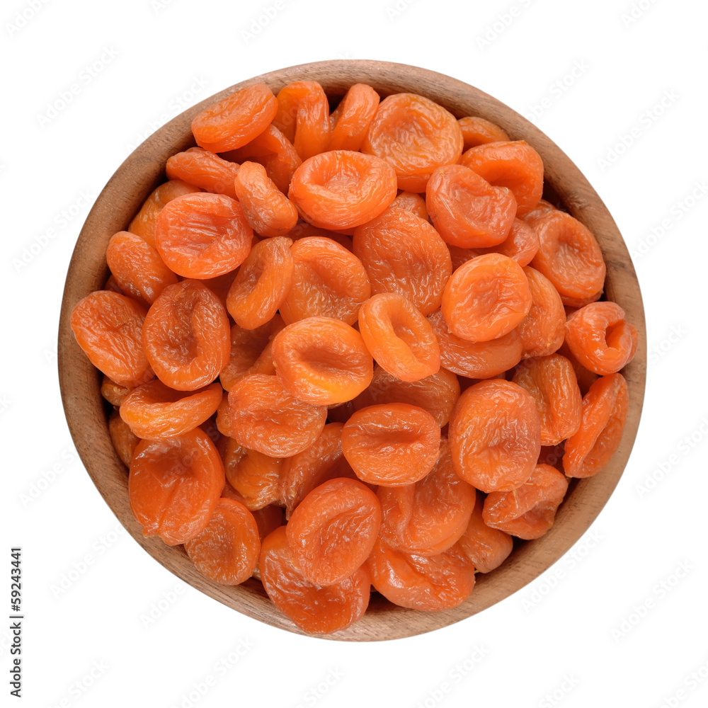 Dried apricots in a wooden bowl Dried apricots in a wooden bowl