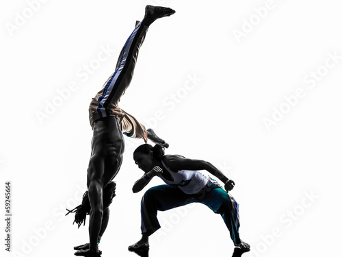 couple capoeira dancers dancing silhouette