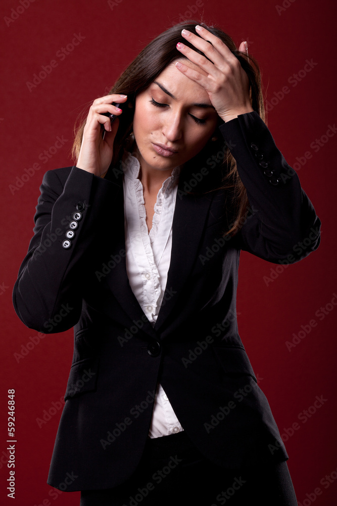 Portrait of stressed business woman having head pain over white Portrait of stressed business woman having head pain over white