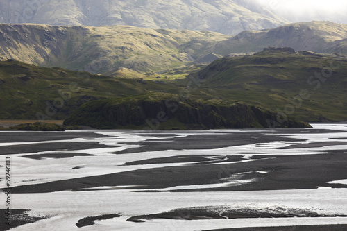 Fototapeta Iceland. East fjords. Lonsvik. Water and sand from glaciers.