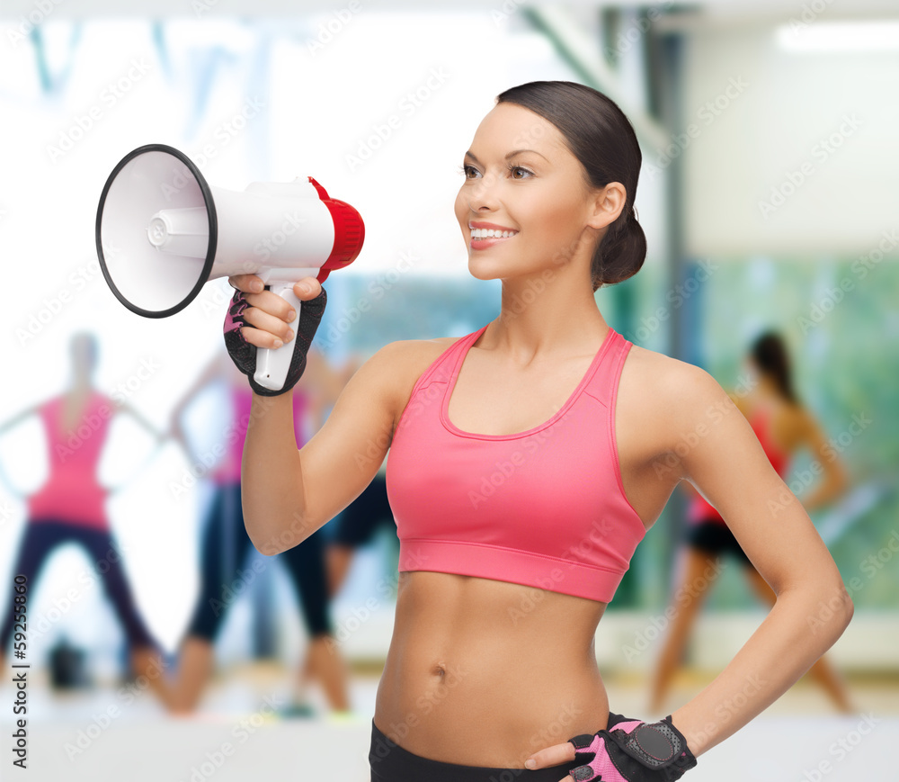 smiling fit woman with megaphone smiling fit woman with megaphone