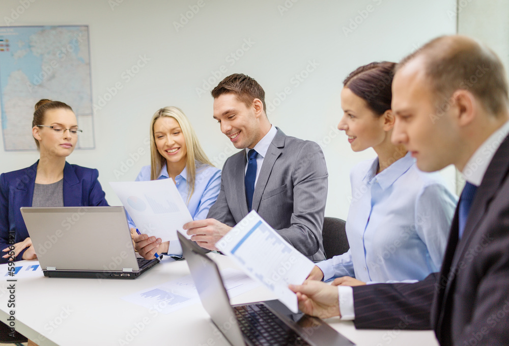 business team with laptop having discussion business team with laptop having discussion