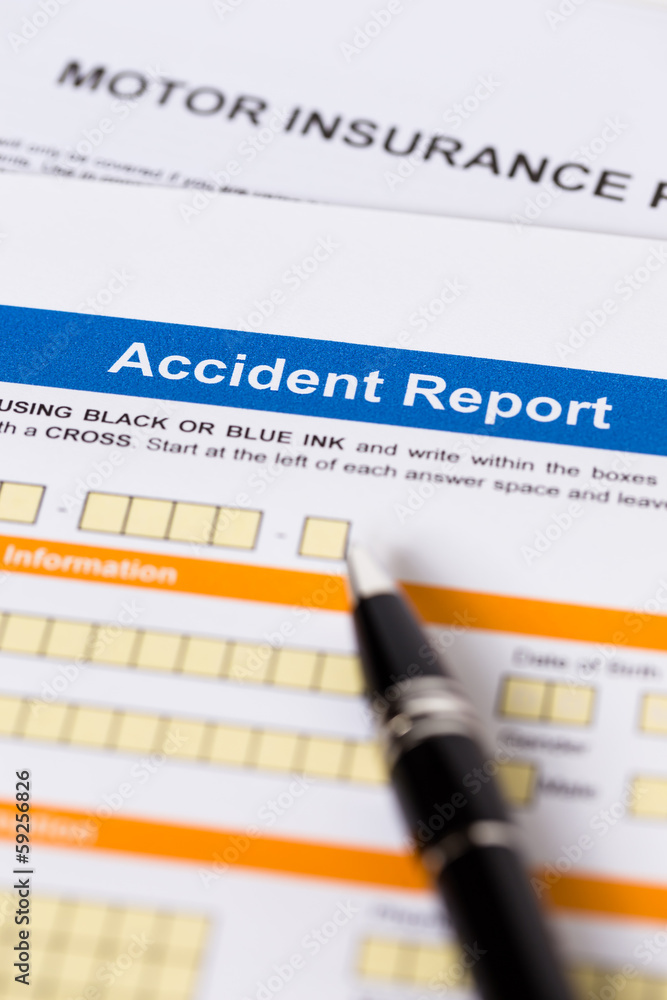 Motor or car insurance accident report form with pen Motor or car insurance accident report form with pen