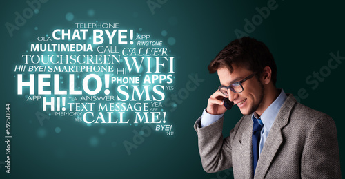 Young man making phone call with word cloud