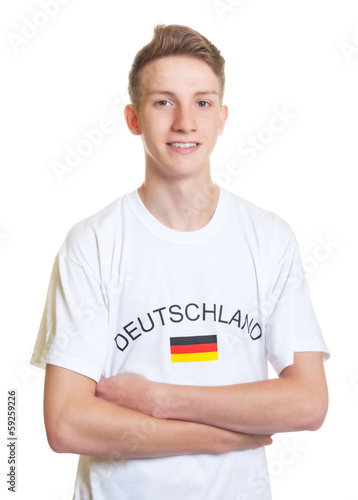 Standing german sports fan with crossed arms photo