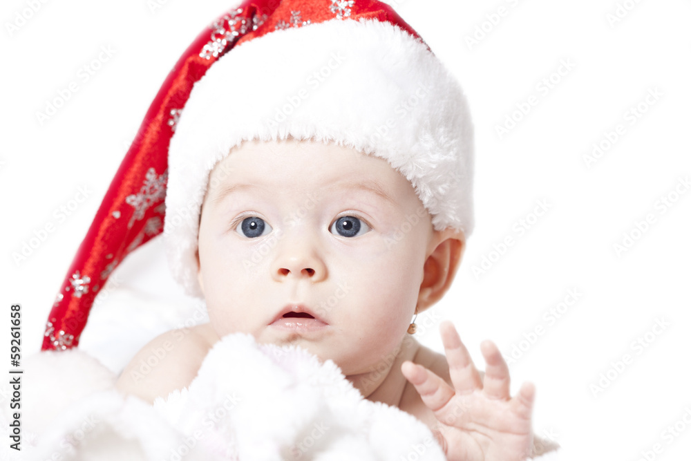Portrait of a baby with Santa hat isolated on white Portrait of a baby with Santa hat isolated on white