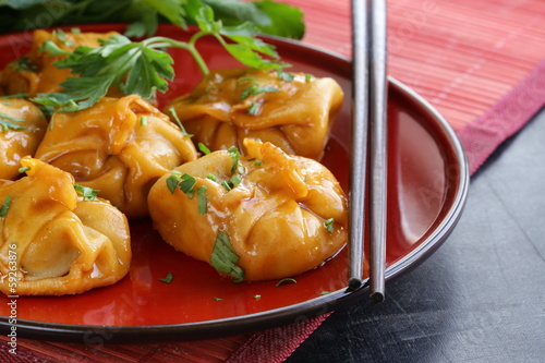 Chinese dumplings - dim sum with sour-sweet sauce photo