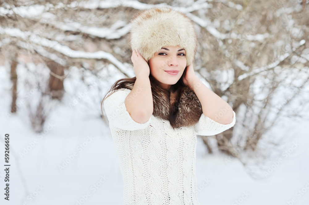 Beautiful brunette posing outdoors in winter Beautiful brunette posing outdoors in winter
