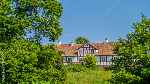 Old withe half timbered farm in romantic landscape