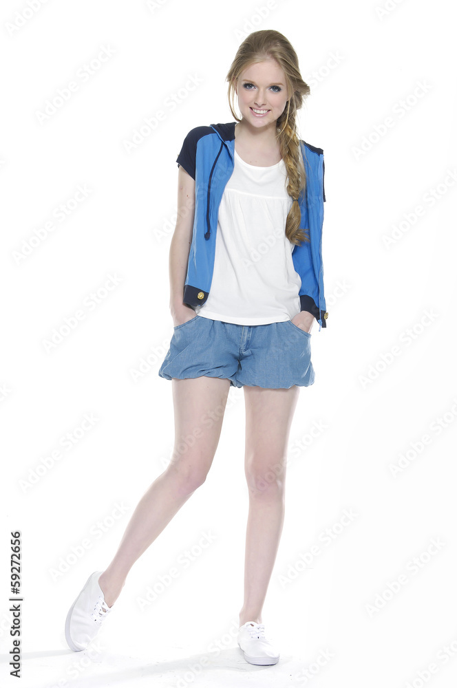 full-length young woman in Shorts posing on white background full-length young woman in Shorts posing on white background