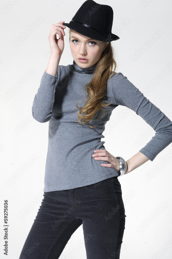 young casual leisure girl in hat posing on white background young casual leisure girl in hat posing on white background