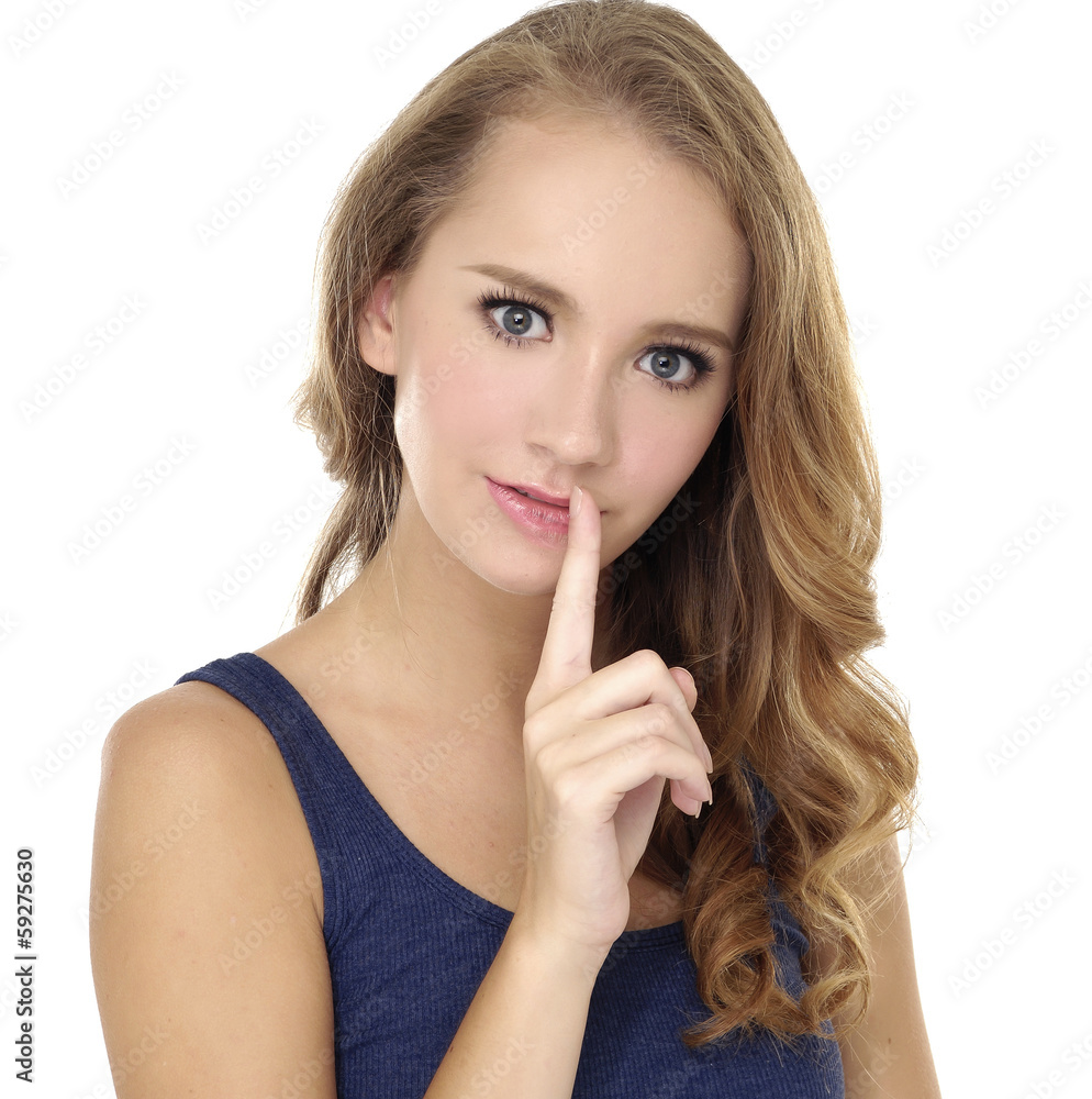 Closeup young woman with finger on lips Closeup young woman with finger on lips