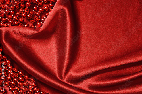 Red satin drapery and beads