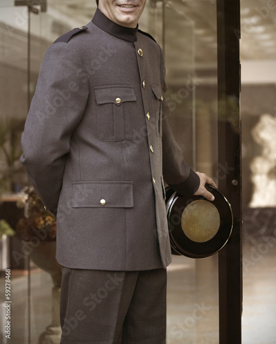Bellhop opening Hotel´s door.