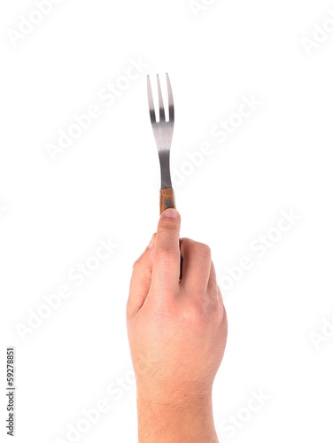 Close up of kitchen fork in hand.