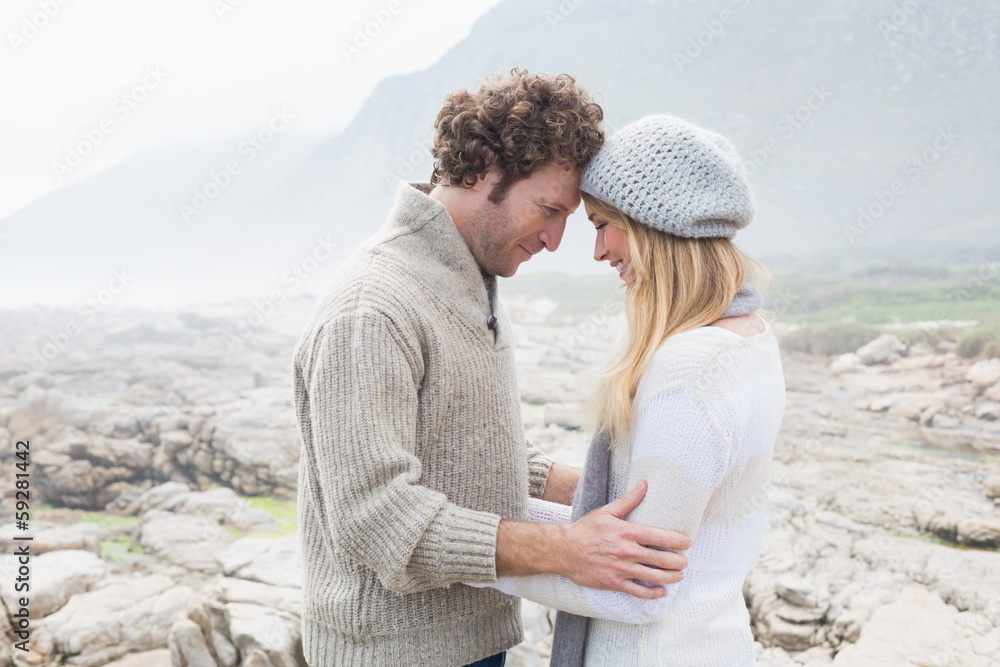 Fototapeta premium Romantic couple standing on a rocky landscape