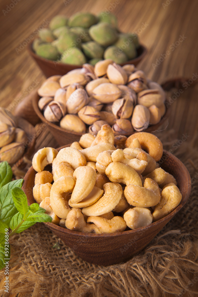 mix nuts on a wooden table mix nuts on a wooden table