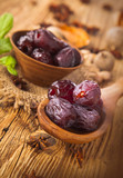 Dates fruit on a wooden table 