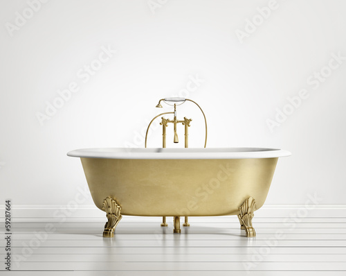 Fotografia Isolated gold bronze classic bathtub on white wood floor