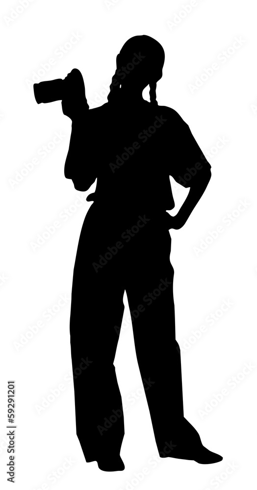 portrait silhouette of a young woman photographer holding a came